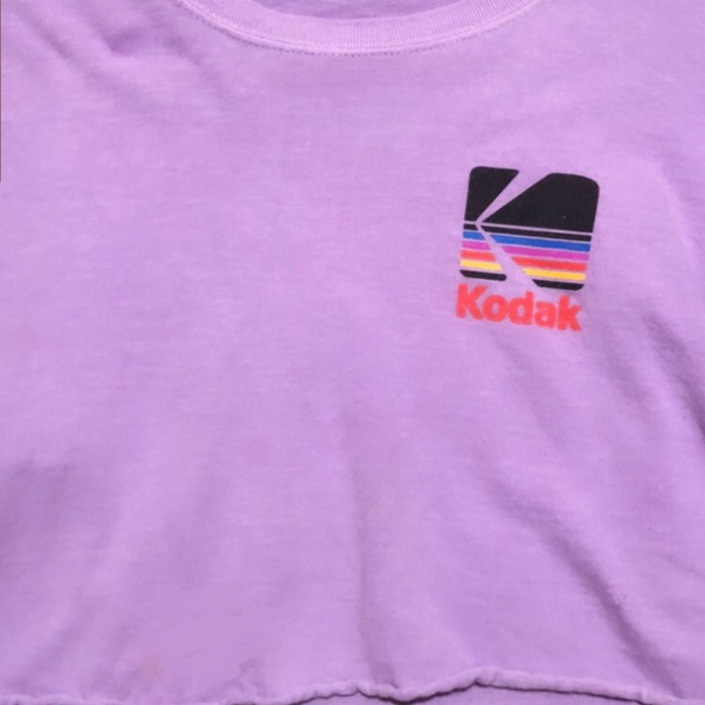 Purple “Kodak” camera cropped graphic tee.